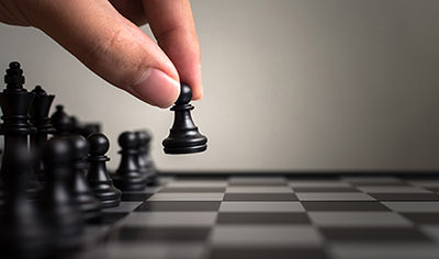 image of chess pieces on gameboard