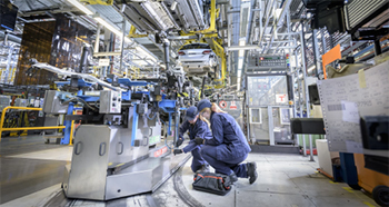 image of quality engineers fixing machine