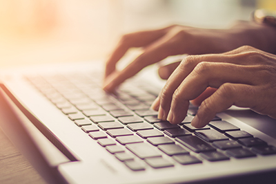 image of typing on keyboard