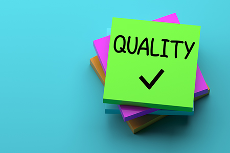 image of notepads with quality checkmark