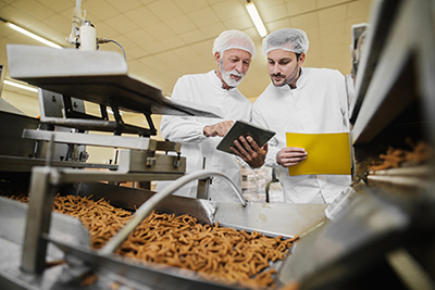 image of men checking food quality