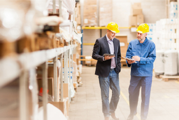 image of men assuring quality in warehouse