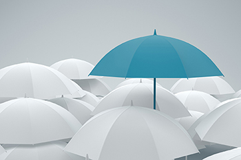 image of blue umbrella in a group of white ones